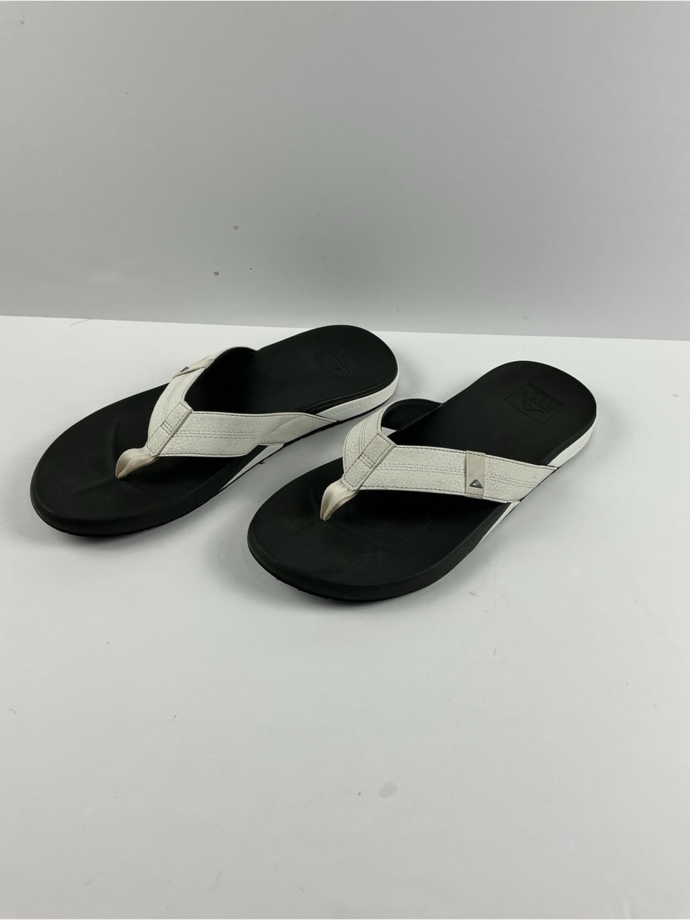 Reef Black Footbed Flip Flops with White Straps